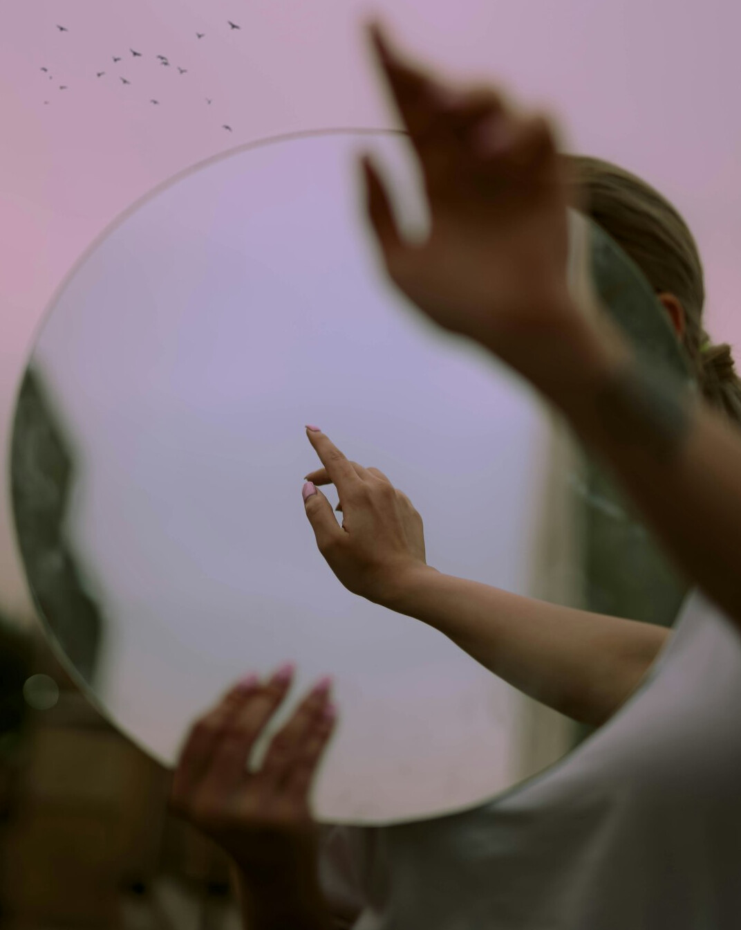 person reflecting in mirror
