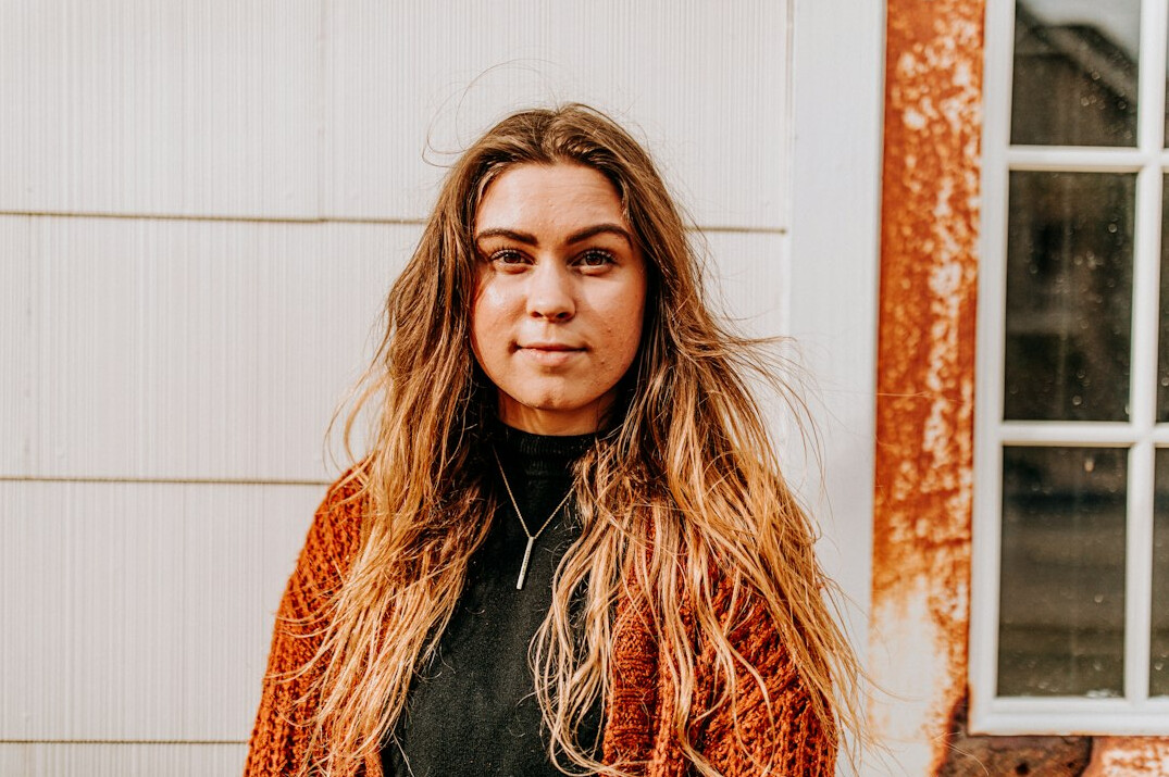 Portrait of a woman with long hair smiling