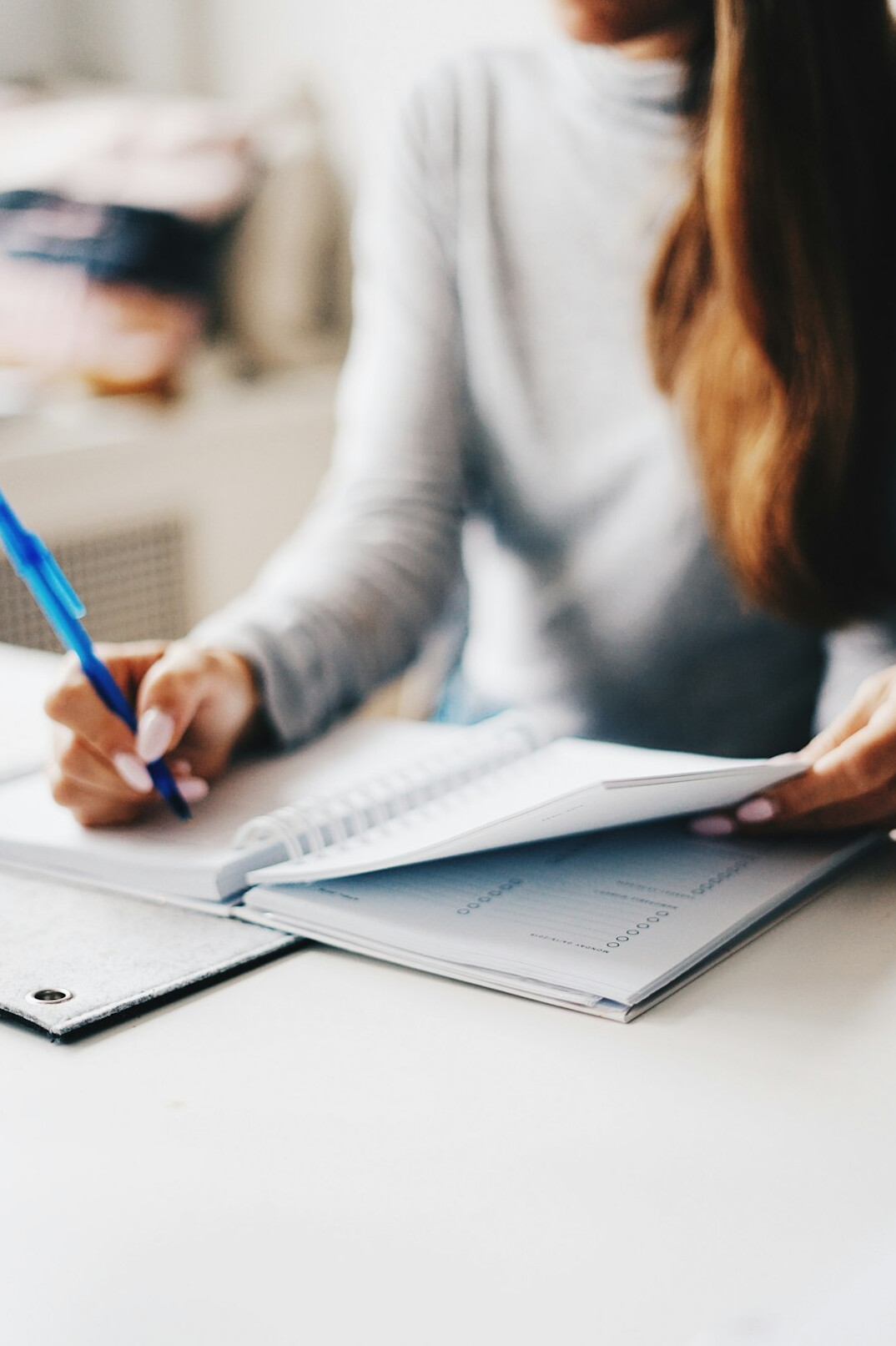 person setting goals on paper