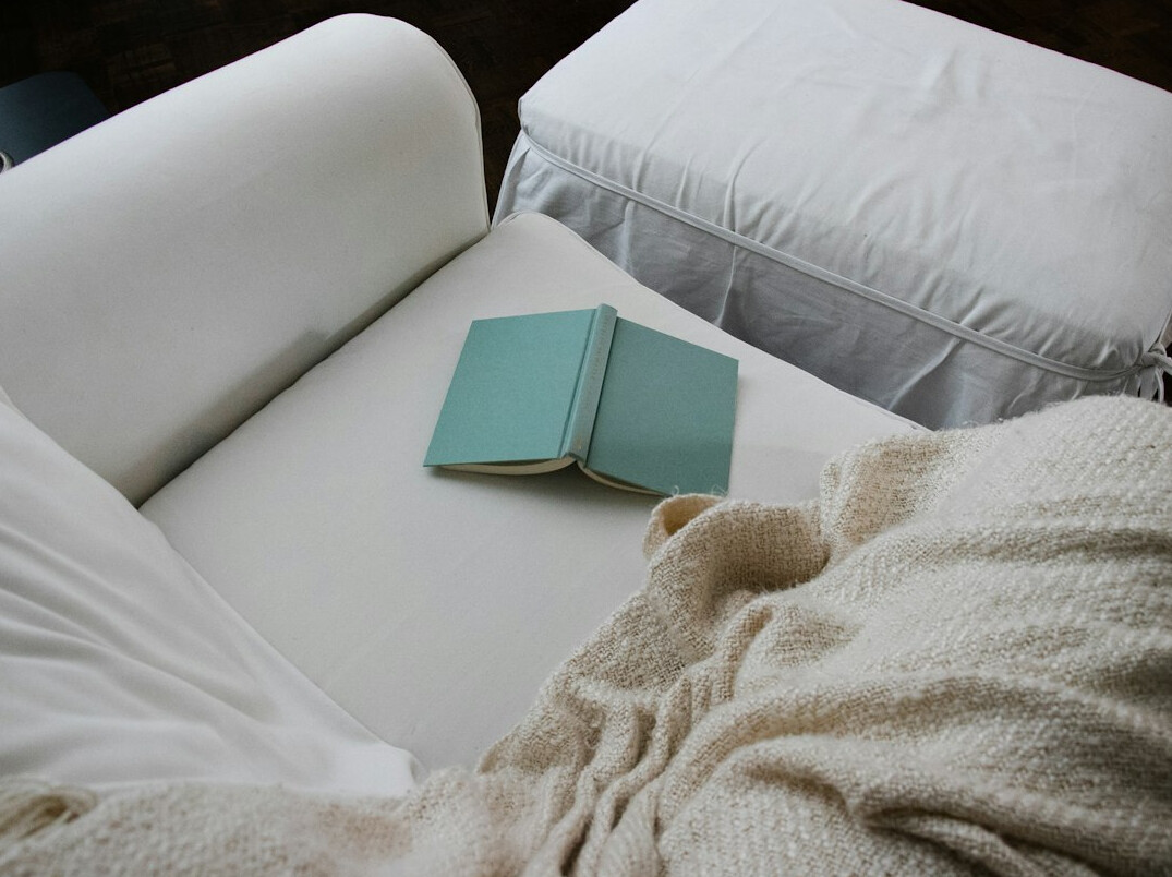 person reading book in quiet room